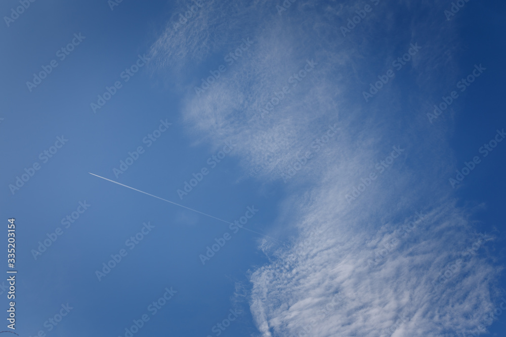 Blue sky with beautiful white clouds at sunny day and flying airplane Blue sky with beautiful white clouds at sunny day and flying airplane