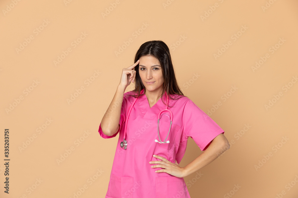 Young doctor wearing pink uniform