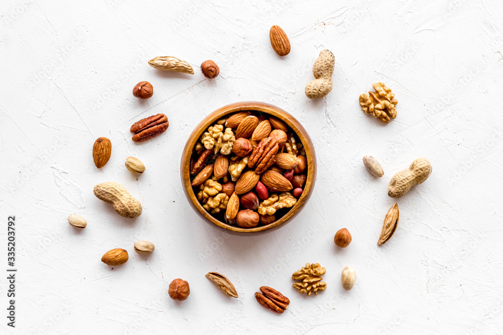 Mixed nuts in bowl on white background top-down Mixed nuts in bowl on white background top-down