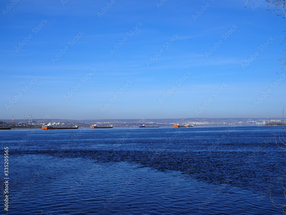 Cargo ships stand in the roadstead on the Volga River near Saratov