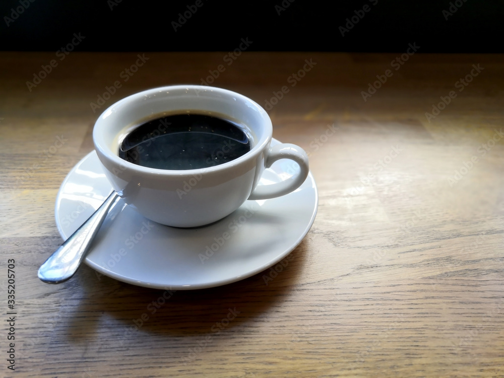 Delicious cup of coffee on the wooden table. Delicious cup of coffee on the wooden table.