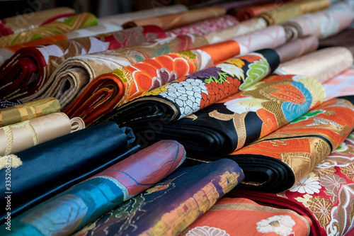 Fotografiet colorful japanese kimono belt obi for sale at market