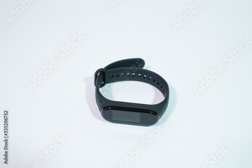 Black fitness bracelet on a white background. Isolate