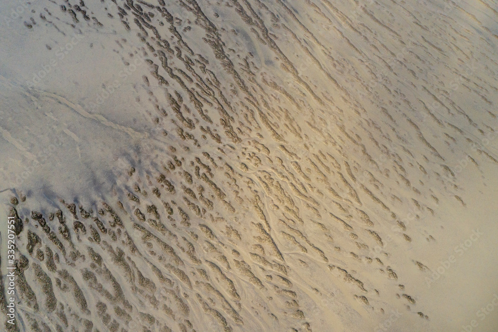 Obraz premium Aerial view on the Kaipara Harbour mudflats close to Ruawai, New Zealand.