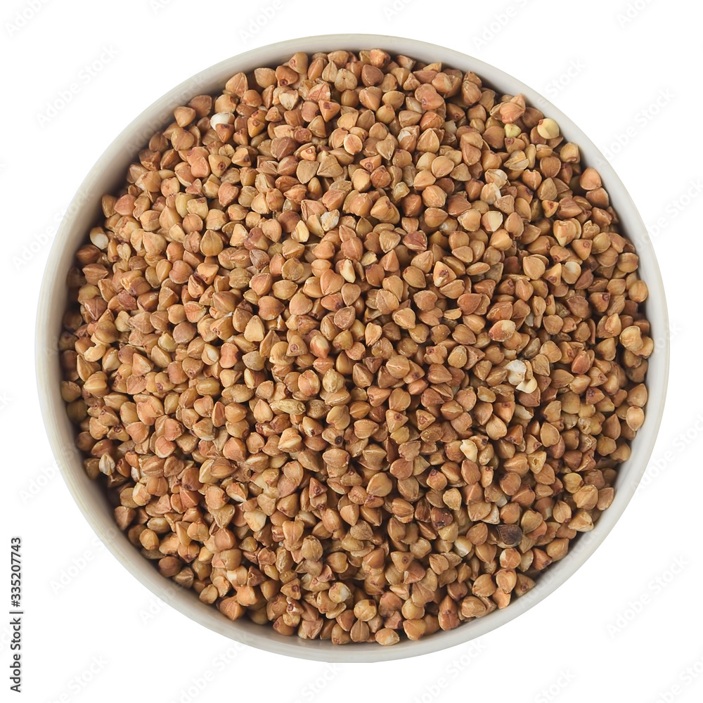 Buckwheat groats in a ceramic plate isolated on a white background. View from above Buckwheat groats in a ceramic plate isolated on a white background. View from above