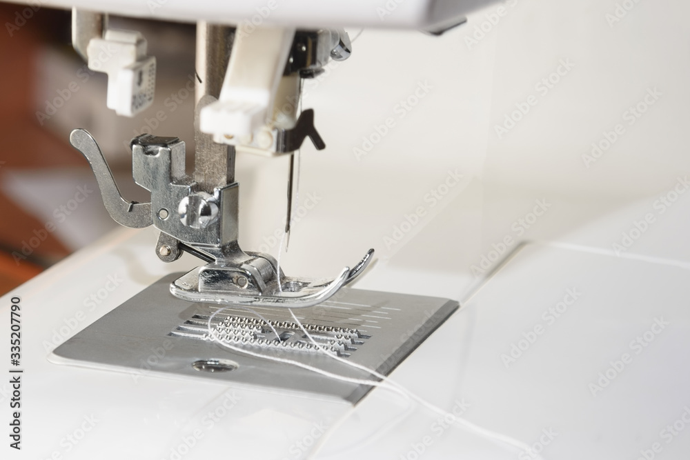 Close up part of a modern sewing machine