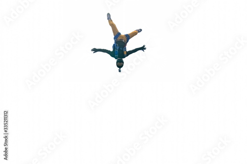 Dynamic. Skydiver is in free fall. Parachutist uses professional equipment.Extreme people flying in open air.  Freedom as a way of life.  © Viktor