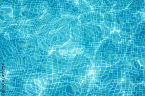 Clean blue water in swimming pool