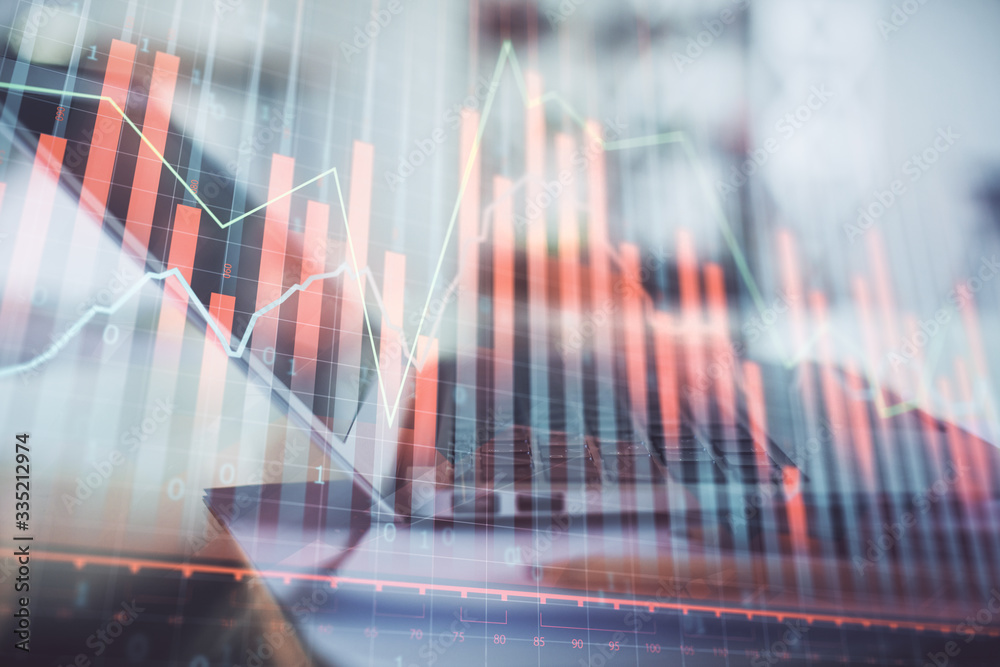 Forex graph hologram on table with computer background. Double exposure. Concept of financial markets.