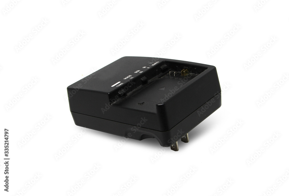 At the camera battery charger isolated on white background At the camera battery charger isolated on white background