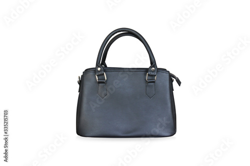 Black leather bag is medium in size with short handles standing on isolated white background with clipping path.