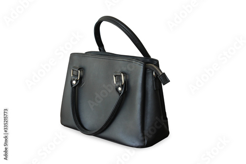 Black leather bag is medium in size with short handles standing on isolated white background with clipping path.