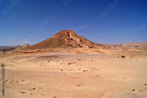 Beautiful panorama of the Sinai Desert. Mountains and sands of different shades. Clear blue sky © Olga