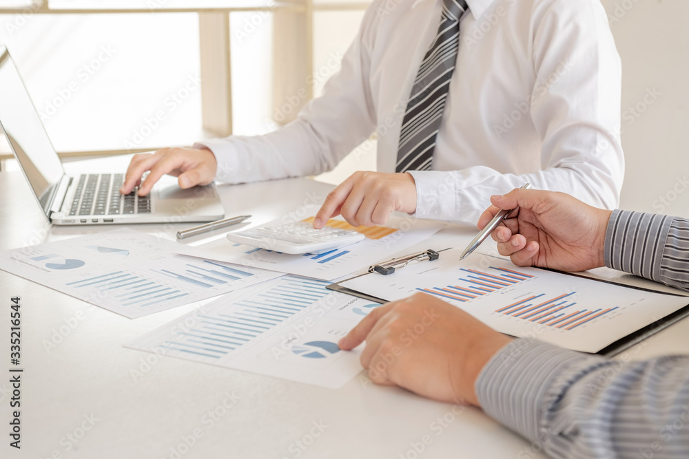 Two business leader discussing the charts and graphs showing the results, Planning to start new strategy for big success Two business leader discussing the charts and graphs showing the results, Planning to start new strategy for big success