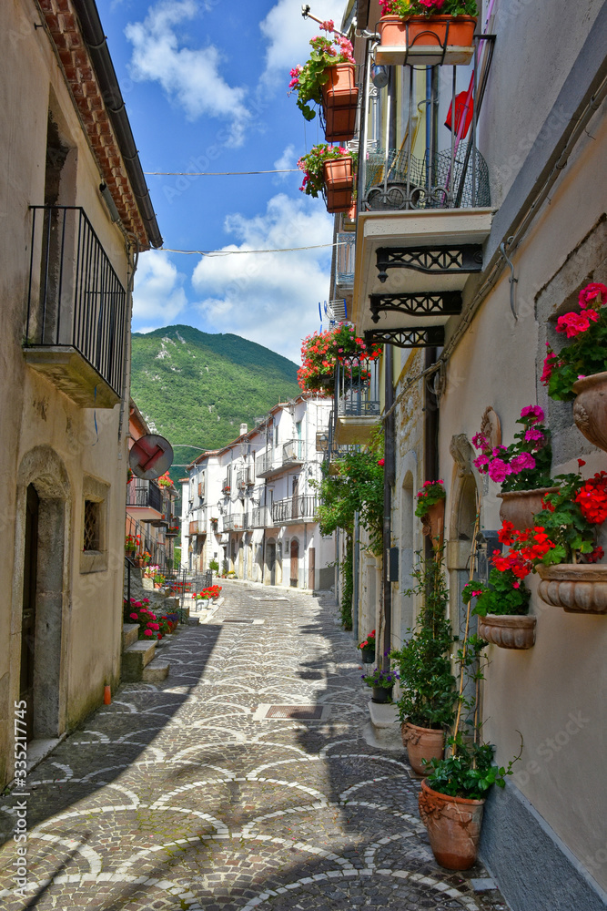 Fototapeta premium Pizzone, Italy, 07/12/2018. A narrow street between the houses of a village in the Molise region