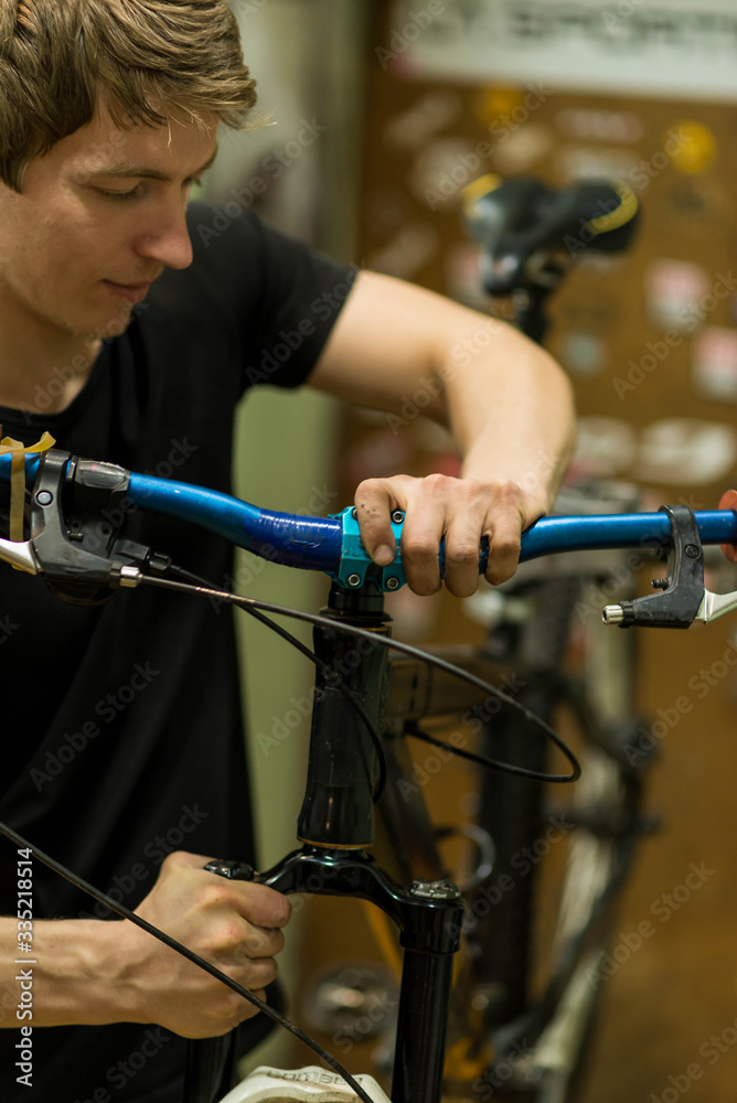 Cyclist mends a bicycle bar, closeup. Cyclist mends a bicycle bar, closeup.