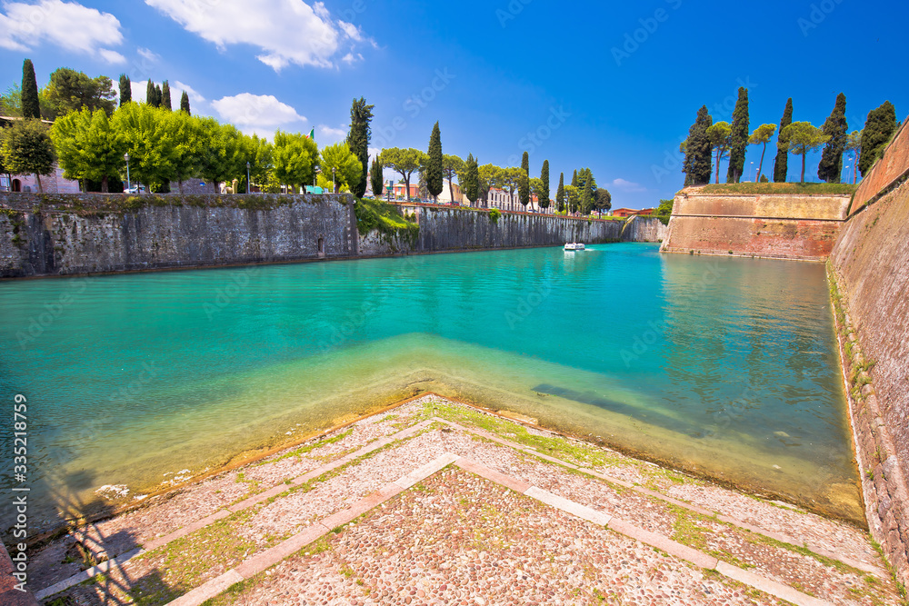 Peschiera del Garda turquoise channel around town walls view,