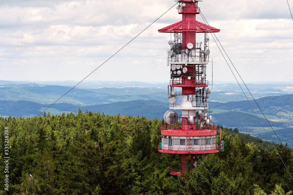 Telecommunication tower with transmitters and aerials, wireless communication and internet traffic increase concept Telecommunication tower with transmitters and aerials, wireless communication and internet traffic increase concept
