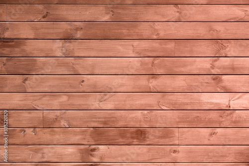 wooden texture from horizontal boards of brown color, close up.