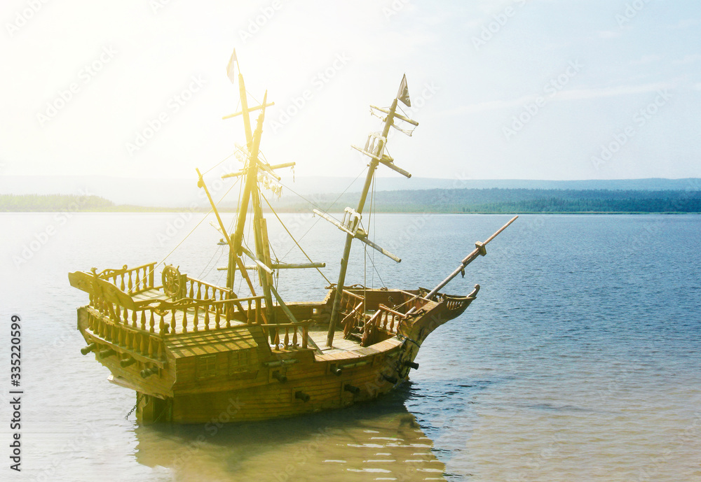 old wooden ship with mast anchored in the sun old wooden ship with mast anchored in the sun