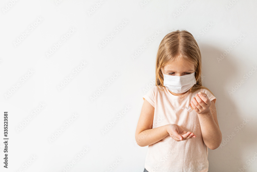 Little caucasian girl using Hand sanitizer alcohol gel for clean hands hygiene prevention of coronavirus virus outbreak. Keeping hands clean during covid-19 pandemic quarantine Little caucasian girl using Hand sanitizer alcohol gel for clean hands hygiene prevention of coronavirus virus outbreak. Keeping hands clean during covid-19 pandemic quarantine