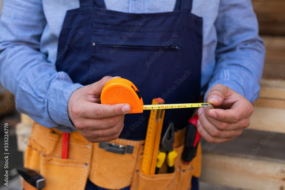 Close up construction tool belt and work instruments Close up construction tool belt and work instruments