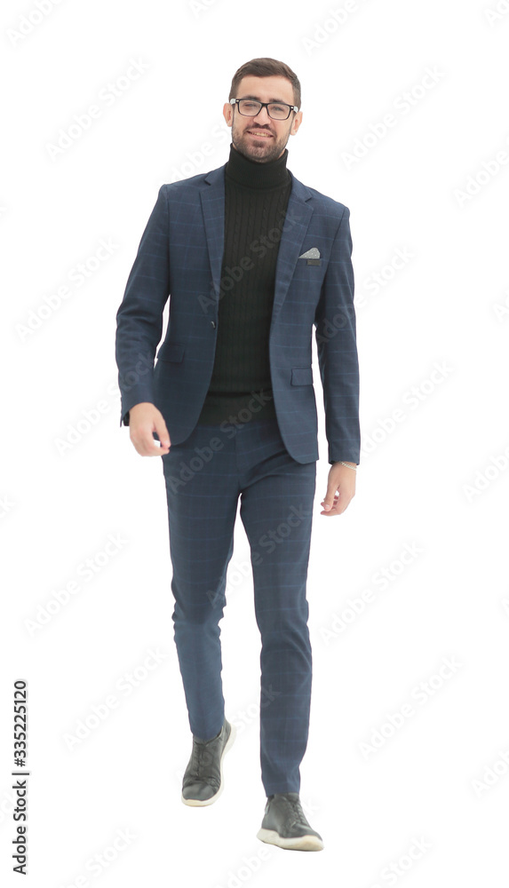in full growth. confident business man taking a step forward in full growth. confident business man taking a step forward