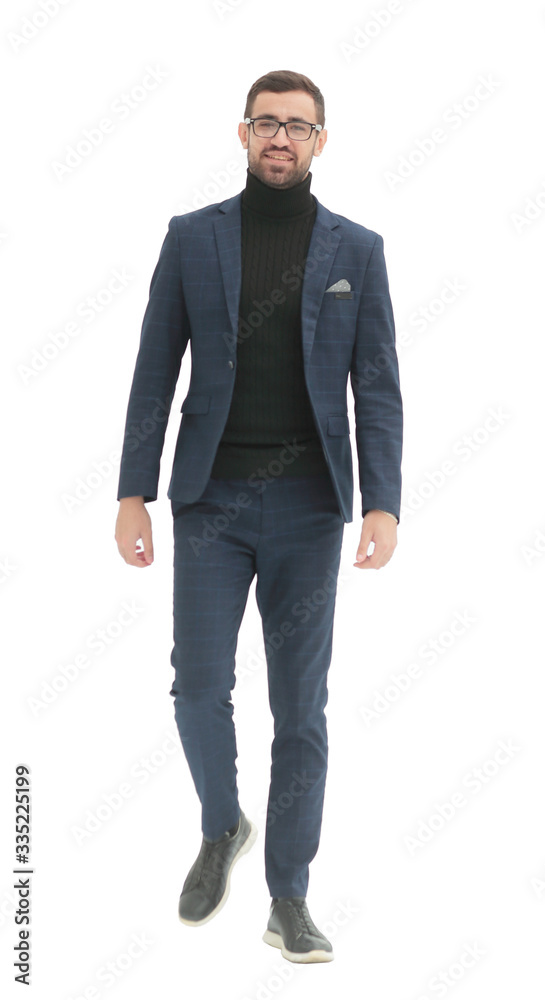 in full growth. confident business man taking a step forward in full growth. confident business man taking a step forward