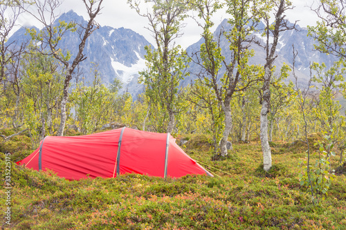 red tent in wilderness in Norwegian Lapland 