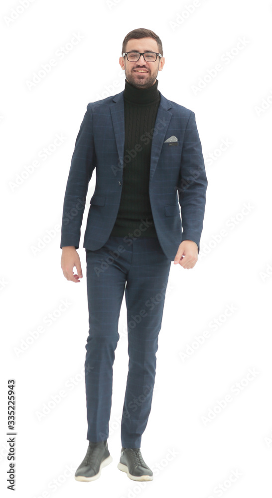 in full growth. confident business man taking a step forward in full growth. confident business man taking a step forward
