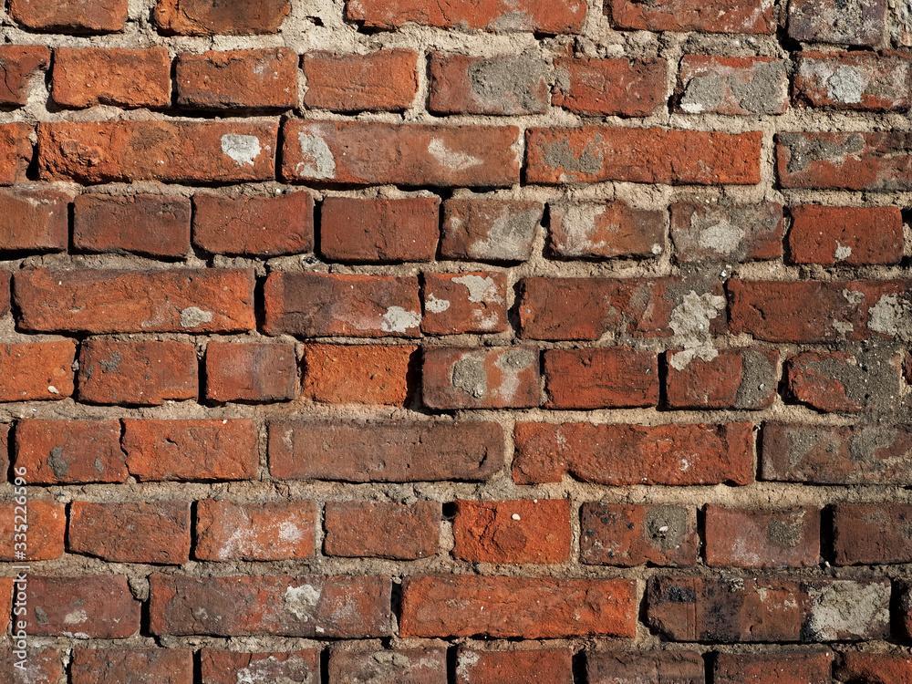 Fototapeta premium wall of old damaged red brick