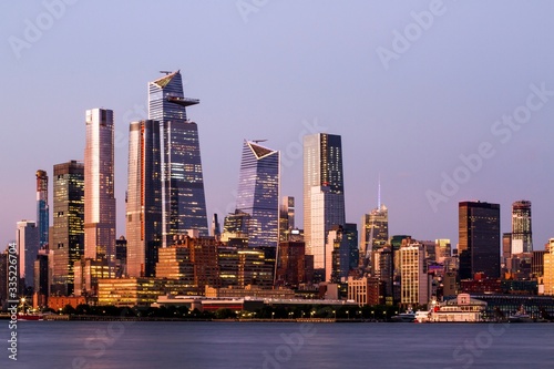 Beautiful view of New York city skyline with waterfront at sunset, USA