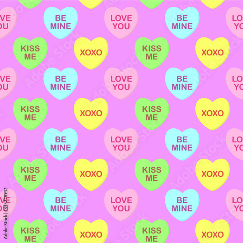Seamless cute colorful vector valentine pattern with pastel candy hearts with text on pink background. Gift wrapping paper, interior, cloth, fabric or web design.