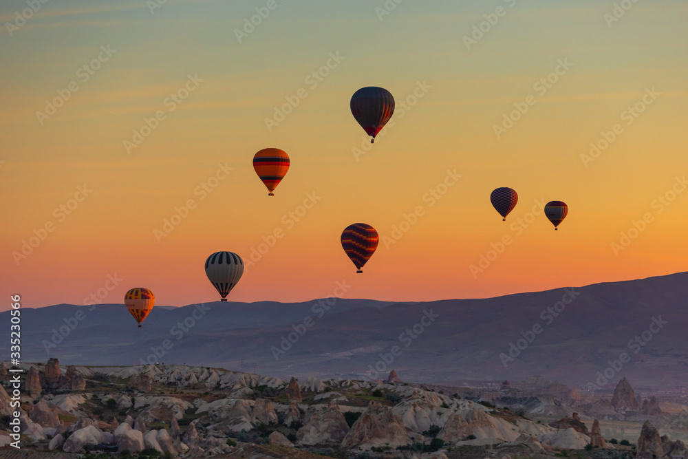 Hot Air balloons flying over amazing rock forms in Cappadocia Hot Air balloons flying over amazing rock forms in Cappadocia
