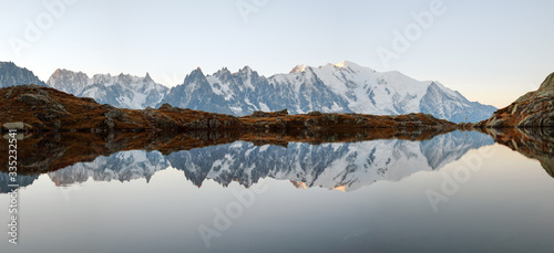 Fototapeta Naklejka Na Ścianę i Meble -  Picturesque panorama of Chesery lake (Lac De Cheserys) and snowy Monte Bianco mountains range on background, Chamonix, France Alps