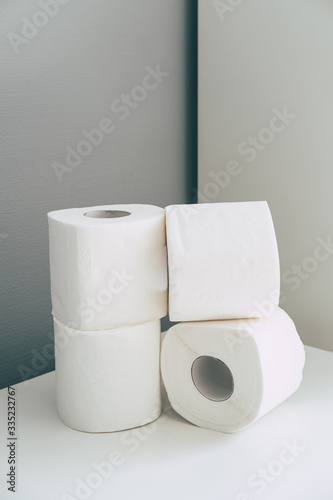 Toilet paper rolls in stack in isometric style in grey and white colors. Coronavirus infection. Pandemic panic concept.