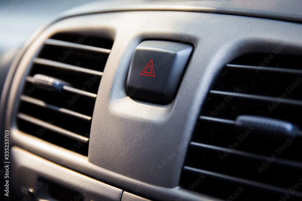 warning button in a car. modern car dashboard to activate hazard lights