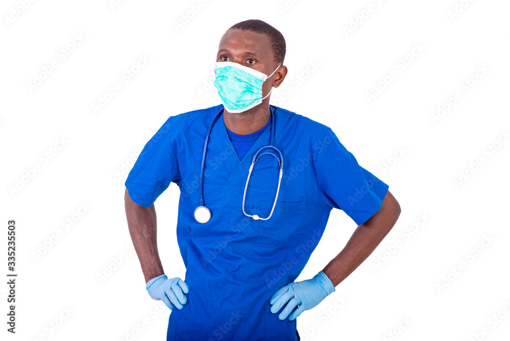 young male doctor keeping hands on his hips. young male doctor keeping hands on his hips.