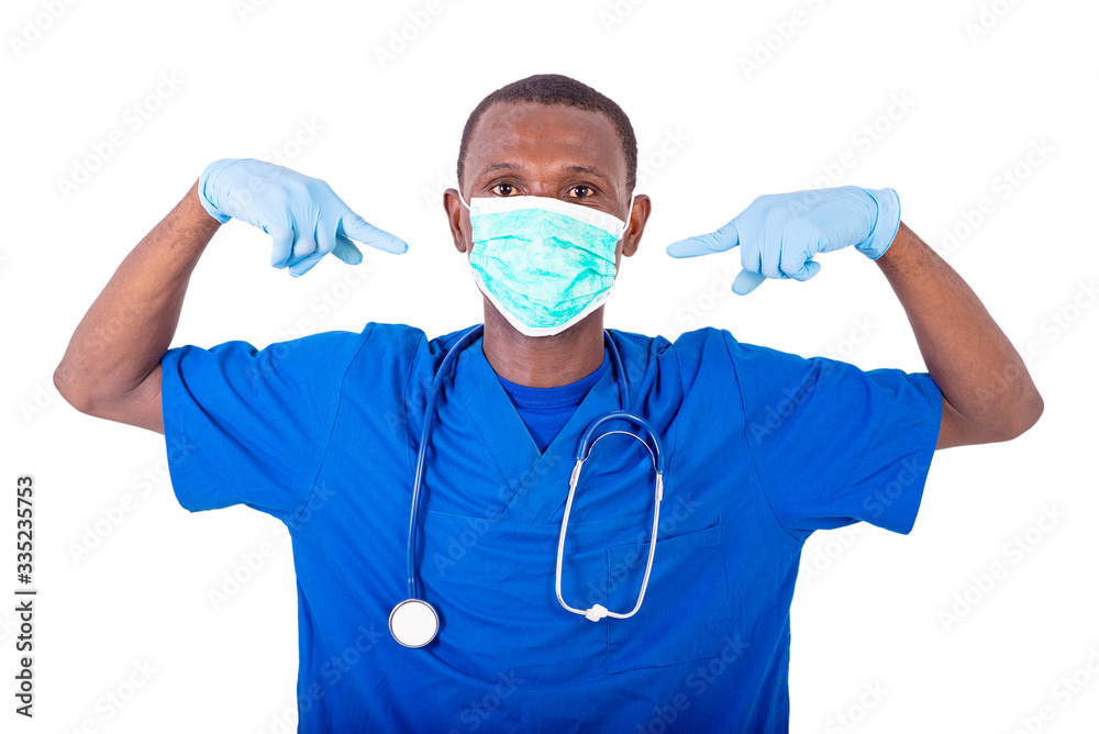 young male doctor pointing finger on medical mask. young male doctor pointing finger on medical mask.