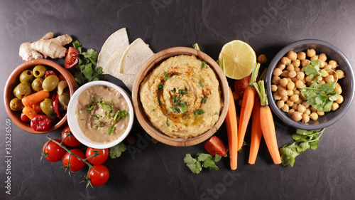 hummus with pita bread and vegetable
