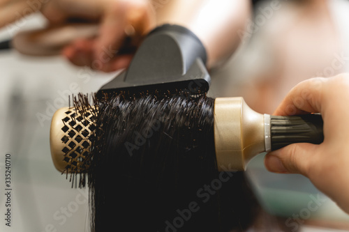 Close up of female hand that combing hair