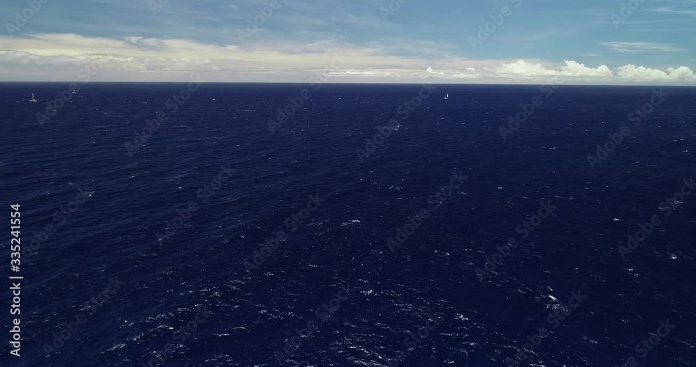 Aerial point of view, sailboat off the coast of Thailand, in blue water Aerial point of view, sailboat off the coast of Thailand, in blue water