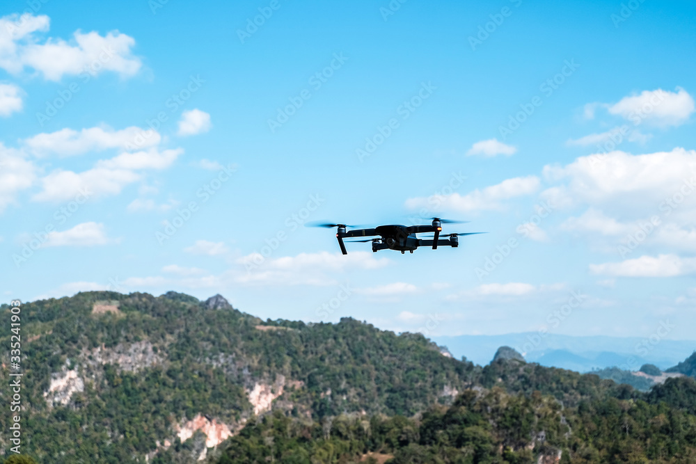 The drone is flying in the air waiting to be controlled. The drone is flying in the air waiting to be controlled.