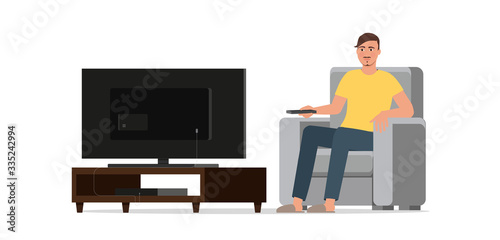 Man watches TV while sitting in a chair.