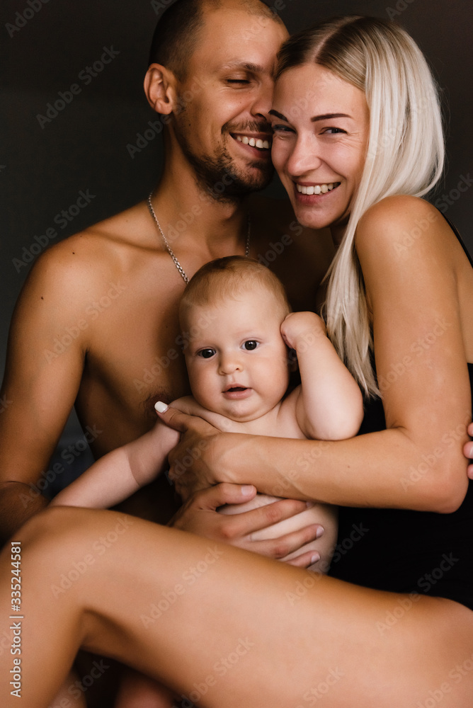 family, mother, father and children, sons, at home, warm family relationships, hug, kiss children, enjoy life together, games with the whole family, stay home family, mother, father and children, sons, at home, warm family relationships, hug, kiss children, enjoy life together, games with the whole family, stay home