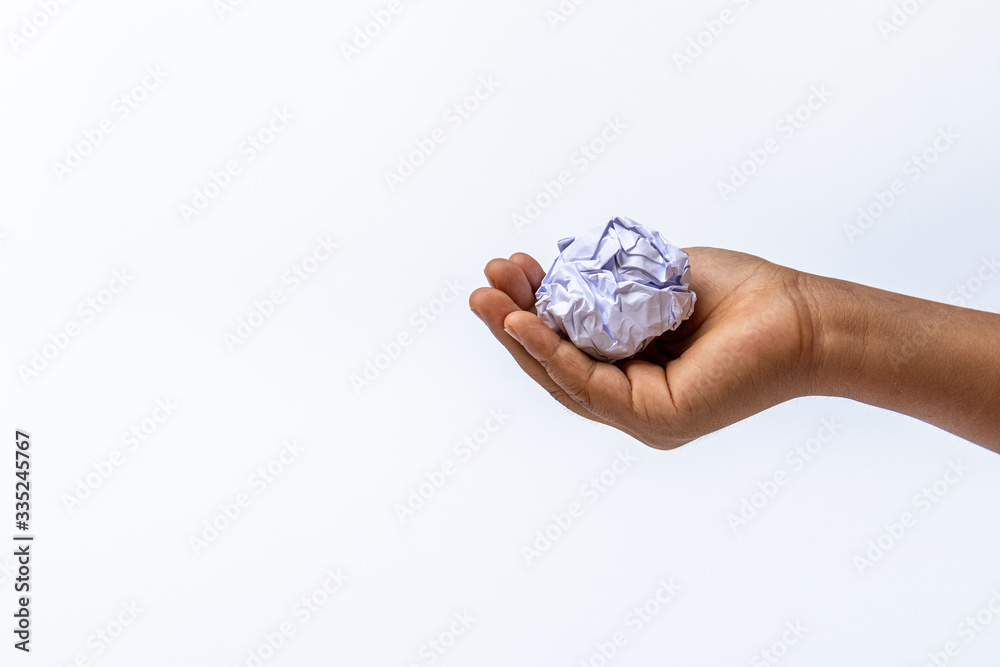Hand holding crumpled paper or white paper ball on white background. - fail creativity concept. Hand holding crumpled paper or white paper ball on white background. - fail creativity concept.