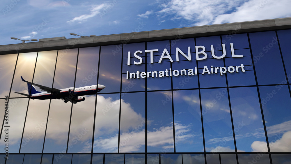 Obraz premium Airplane landing at Istanbul mirrored in terminal