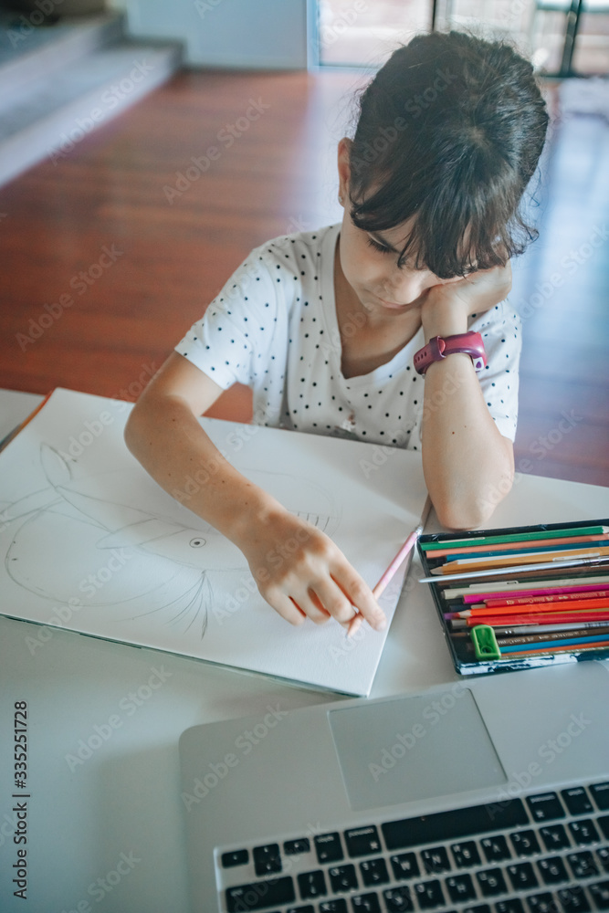 young caucasian girl drawing at home, on-line art calss, home schooling, stay home education young caucasian girl drawing at home, on-line art calss, home schooling, stay home education