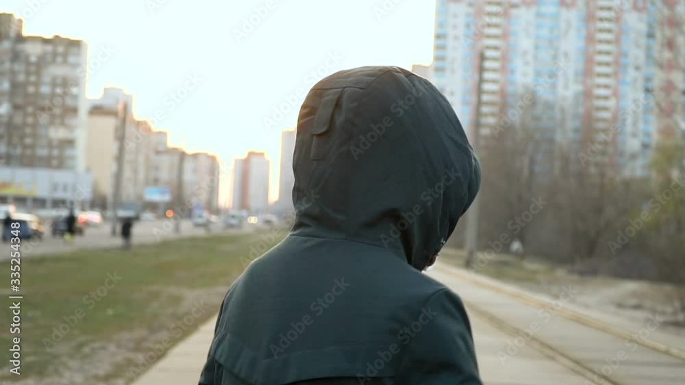 Boy in a medical mask on the street Boy in a medical mask on the street