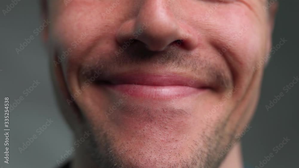 Close up of a Mans mouth smiling and frowning Close up of a Mans mouth smiling and frowning